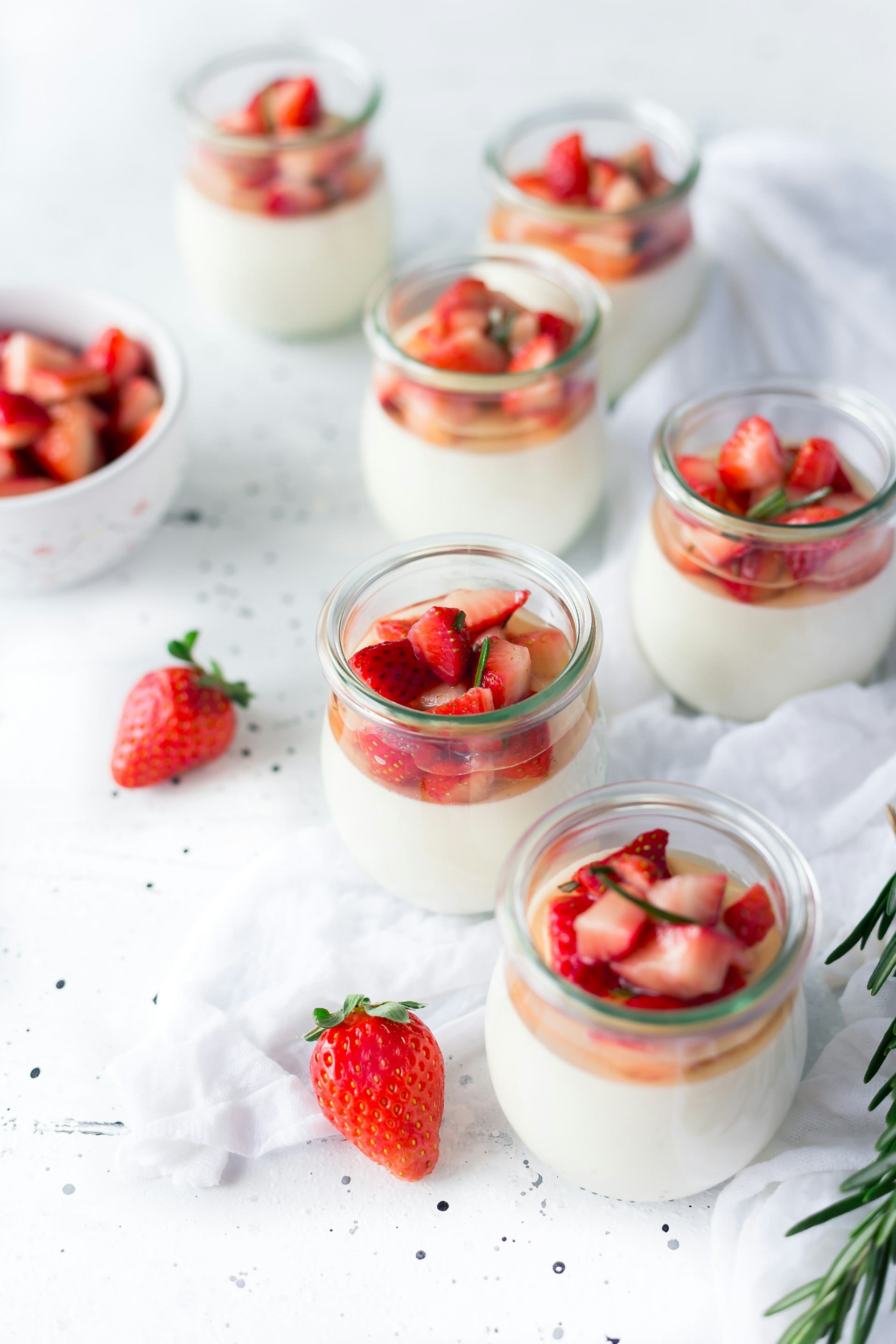 Strawberry parfaits in glass jars, ready for sale